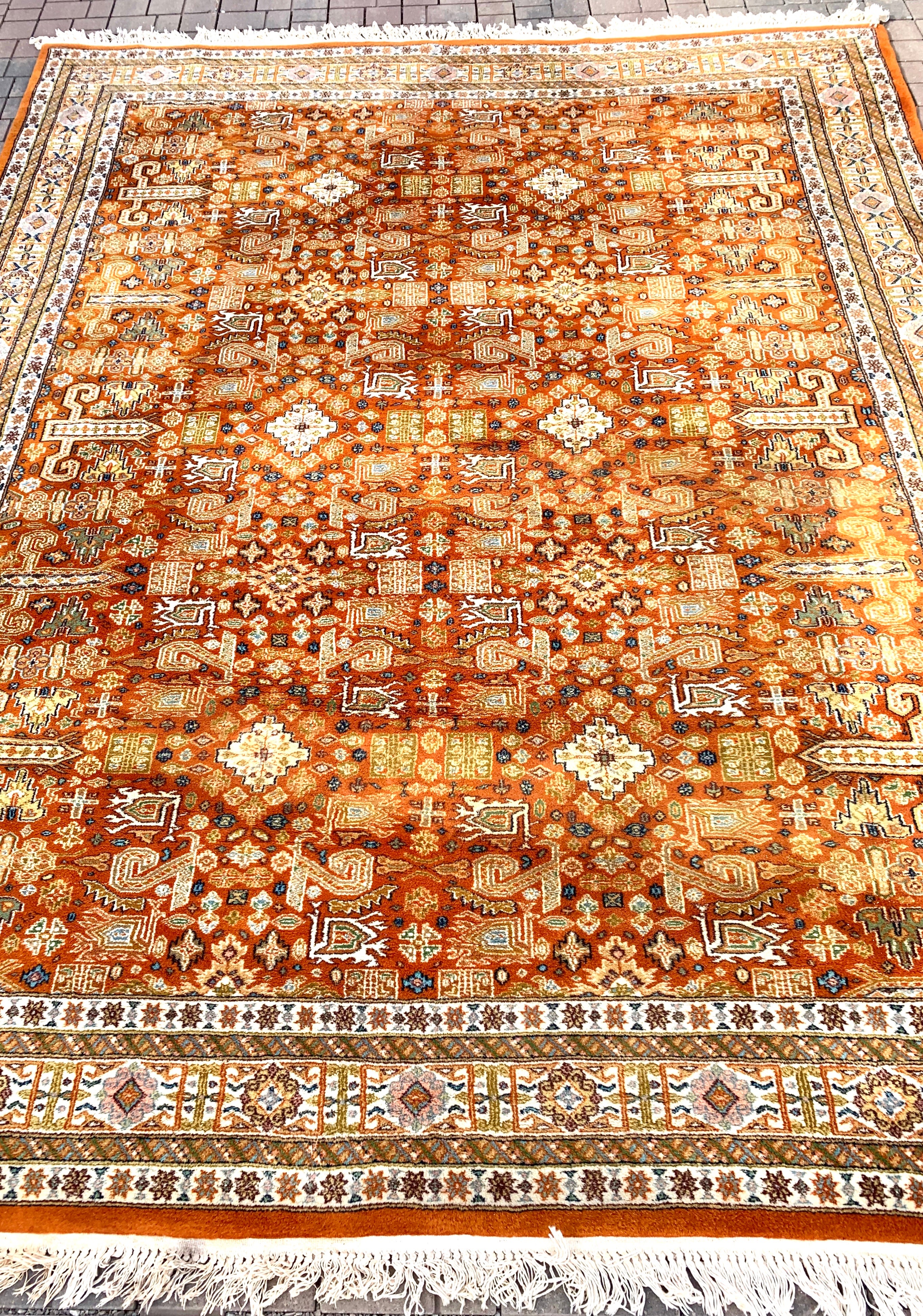 Vintage 7’ x 10’ Knotted Rug in Rust