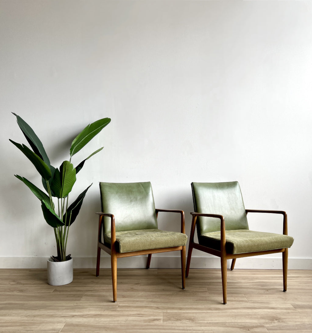 Mid Century Arm Chairs in leather by Stow & Davis